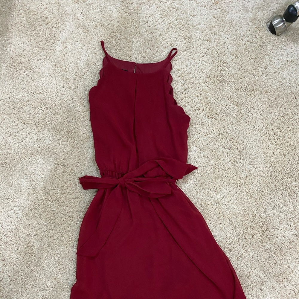 Maroon dress with scallops and a tie